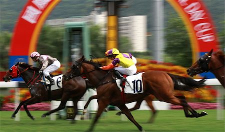 The Horse Racing at Hong Kong Jockey Club. (got some noise due to high ISO and slight blurry for motion effect) Photographie de stock - Aubaine LD & Abonnement, Code: 400-04467913