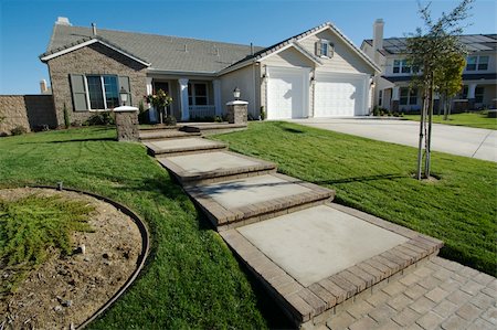 simsearch:614-03359416,k - A newly constructed, modern american home with fresh landscaping. Stock Photo - Budget Royalty-Free & Subscription, Code: 400-04468375