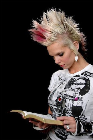 Punk girl reading the Bible isolated over a black background. Stock Photo - Budget Royalty-Free & Subscription, Code: 400-04475323