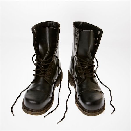 simsearch:700-05973266,k - Black leather boots with laces untied. Photographie de stock - Aubaine LD & Abonnement, Code: 400-04475760