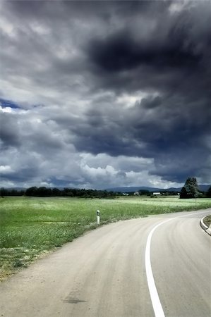 Empty road before the storm , old style soft focus photo Stock Photo - Budget Royalty-Free & Subscription, Code: 400-04477349
