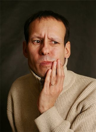 sensitive - Adult man with toothache on dark background Stock Photo - Budget Royalty-Free & Subscription, Code: 400-04479458