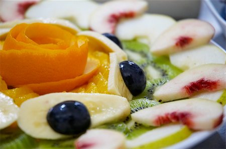 simsearch:400-05367726,k - Perfectly designed fresh juicy fruit salad on plate.  Close-up series. Shallow DOF. Stock Photo - Budget Royalty-Free & Subscription, Code: 400-04473688