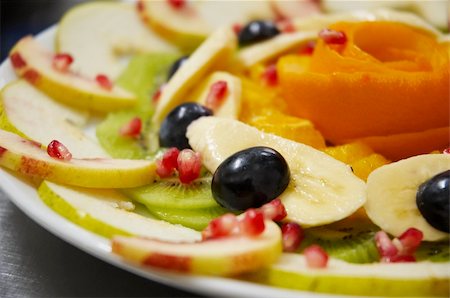 simsearch:400-05367726,k - Perfectly designed fresh juicy fruit salad on plate.  Close-up series. Shallow DOF. Stock Photo - Budget Royalty-Free & Subscription, Code: 400-04473689
