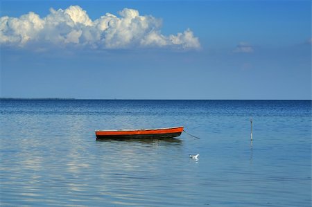On this sea landscape all lonely one boat, one seagull and one cloud a Beautiful idyllic landscape Stock Photo - Budget Royalty-Free & Subscription, Code: 400-04473695