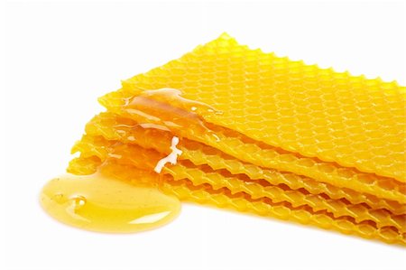 simsearch:400-05135233,k - A honeycomb with honey, reflected on white background Foto de stock - Super Valor sin royalties y Suscripción, Código: 400-04484094