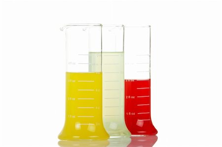 simsearch:649-07279795,k - Three test flasks with liquids reflected on white background. Shallow DOF Stock Photo - Budget Royalty-Free & Subscription, Code: 400-04484093