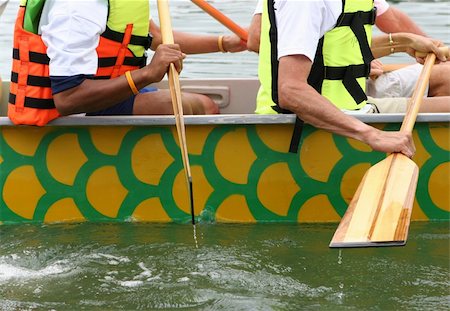 rowing closeup - Close-up of a dragon boat racing team paddling. Stock Photo - Budget Royalty-Free & Subscription, Code: 400-04484696