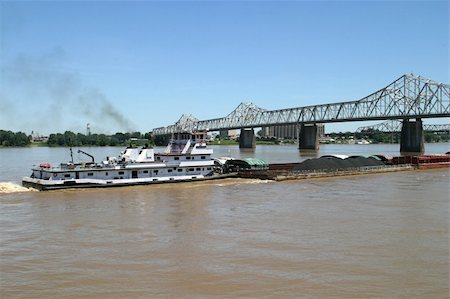 A tugboat pushing a coal barge up the Ohio River. Stock Photo - Budget Royalty-Free & Subscription, Code: 400-04485096