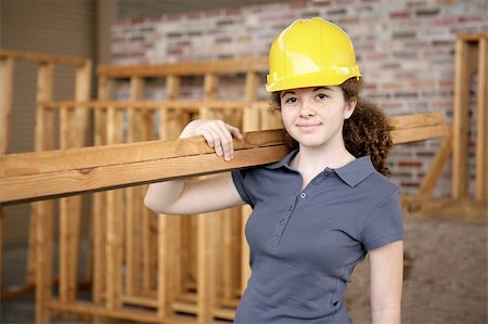 A young female apprentice working on a construction site. Stock Photo - Budget Royalty-Free & Subscription, Code: 400-04485402