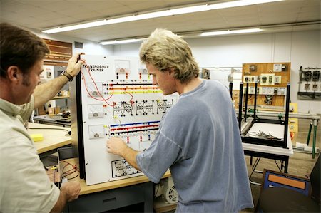 An adult education student learning about transformers.  Focus on the Transformer Trainer Board. Stock Photo - Budget Royalty-Free & Subscription, Code: 400-04485417