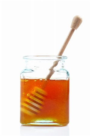 simsearch:400-05135233,k - A wooden drizzler inside of honey jar, reflected on white background Foto de stock - Super Valor sin royalties y Suscripción, Código: 400-04485740