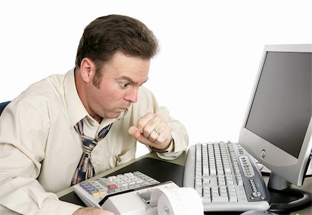 A man choking or coughing while working on the computer.  His eyes are bulging like he's seen something shocking online.  Isolated on white. Stock Photo - Budget Royalty-Free & Subscription, Code: 400-04486178