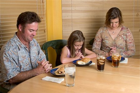 Family praying and saying grace over their meal. Stock Photo - Budget Royalty-Free & Subscription, Code: 400-04487201
