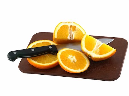 simsearch:400-04716078,k - Sliced of an oranges and knife on brown cooking plank Stock Photo - Budget Royalty-Free & Subscription, Code: 400-04487302