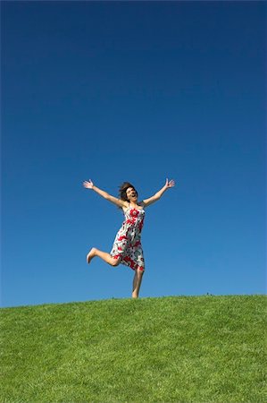 simsearch:400-03934248,k - Happy woman on a beautiful green meadow Stock Photo - Budget Royalty-Free & Subscription, Code: 400-04488256