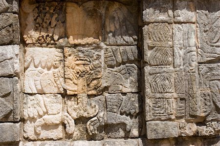 Mayan figures carved into the old stone wall at Chichen Itza. Mexico Stock Photo - Budget Royalty-Free & Subscription, Code: 400-04489483