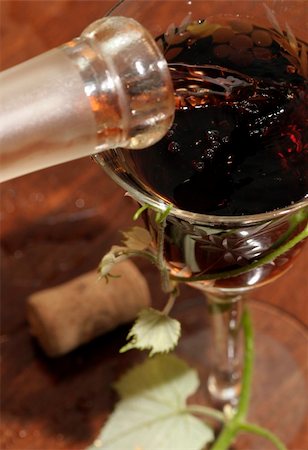simsearch:400-04226436,k - Red wine pouring down from a wine bottle Stock Photo - Budget Royalty-Free & Subscription, Code: 400-04482541