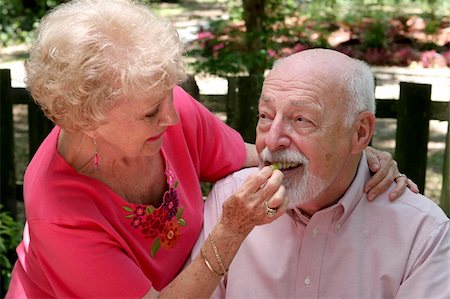 simsearch:400-04208630,k - A senior woman caring for her husband and feeding him a grape. Stock Photo - Budget Royalty-Free & Subscription, Code: 400-04483965