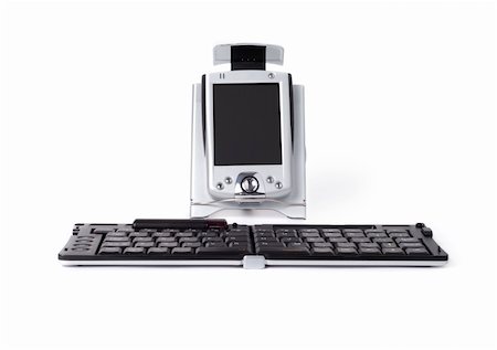 Pocket PC with remote infrared keyboard isolated over white background Stock Photo - Budget Royalty-Free & Subscription, Code: 400-04496831