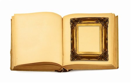 simsearch:400-07332295,k - decorative frame lying on an open book isolated on white Stock Photo - Budget Royalty-Free & Subscription, Code: 400-04498402
