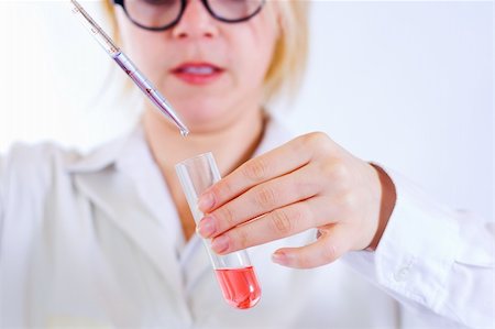 simsearch:400-09011632,k - Scientist woman analyzing chemical material in test tube Stock Photo - Budget Royalty-Free & Subscription, Code: 400-04498552