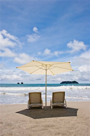 Two chairs and umbrella at the beach. Manuel Antonio, Costa Rica. Stock Photo - Budget Royalty-Free & Subscription, Code: 400-04490809