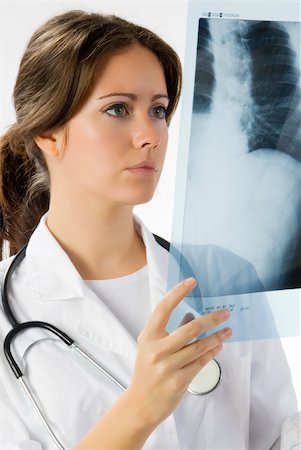 young and beautiful doctor looking at x-ray Stock Photo - Budget Royalty-Free & Subscription, Code: 400-04492081