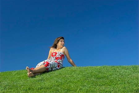 simsearch:400-03934248,k - Beautiful woman relaxing on a beautiful green field Stock Photo - Budget Royalty-Free & Subscription, Code: 400-04493646