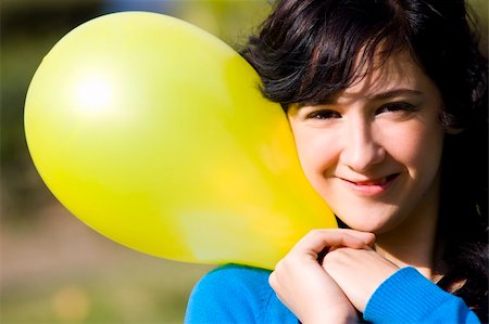 Cute girl with yellow colored balloon Stock Photo - Budget Royalty-Free & Subscription, Code: 400-04504429