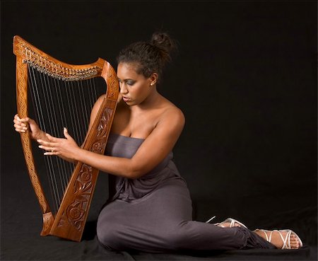 portrait of young beautiful woman with harp Stock Photo - Budget Royalty-Free & Subscription, Code: 400-04504779