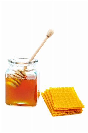 simsearch:400-05135233,k - A wooden drizzler inside of honey jar and honeycomb on white background Foto de stock - Super Valor sin royalties y Suscripción, Código: 400-04507395