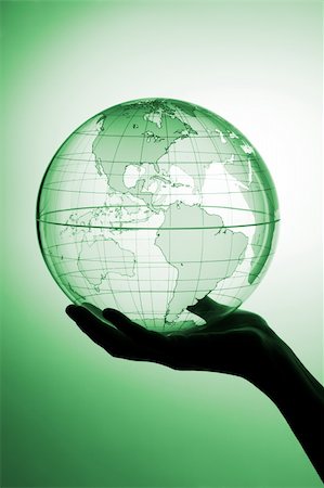 A hand holding translucent globe Stock Photo - Budget Royalty-Free & Subscription, Code: 400-04509107