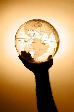 A hand holding translucent globe Stock Photo - Budget Royalty-Free & Subscription, Code: 400-04509109