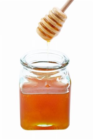 simsearch:400-05135233,k - Pouring honey on glass jar, on white background Foto de stock - Super Valor sin royalties y Suscripción, Código: 400-04501302