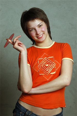 eye laser beam - Cute girl en chemise rouge, tenant le disque compact Photographie de stock - Aubaine LD & Abonnement, Code: 400-04501684