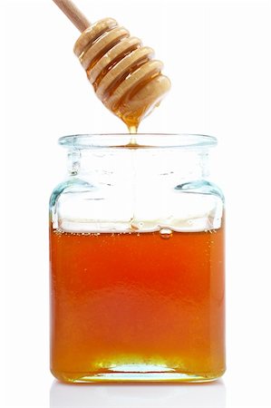 simsearch:400-05135233,k - Pouring honey on glass jar, on white background Foto de stock - Super Valor sin royalties y Suscripción, Código: 400-04503195