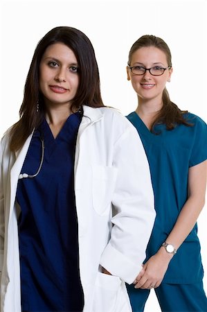 simsearch:400-07411030,k - Two woman healthcare workers one wearing a doctors lab coat the other in scrubs standing on white Stock Photo - Budget Royalty-Free & Subscription, Code: 400-04503245