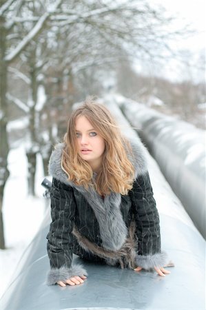 frozen pipes - Girl lays in heating main during cold winter day Stock Photo - Budget Royalty-Free & Subscription, Code: 400-04514965