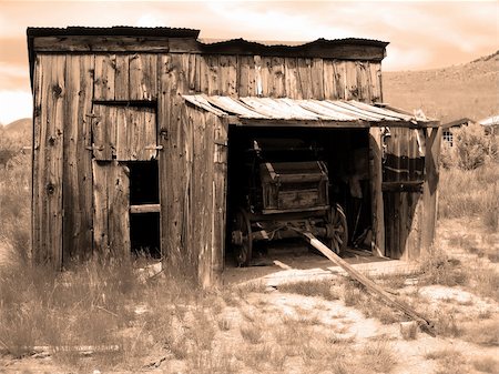 A horse-drawn carriage parked in an old abandoned garage Photographie de stock - Aubaine LD & Abonnement, Code: 400-04514982