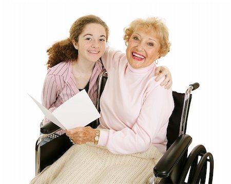 Teen girl gives greeting card to her grandmother for mothers day or other holiday. Stock Photo - Budget Royalty-Free & Subscription, Code: 400-04515363