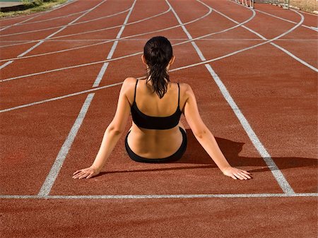 simsearch:400-04785051,k - young woman at red stadium track curve Stock Photo - Budget Royalty-Free & Subscription, Code: 400-04516164