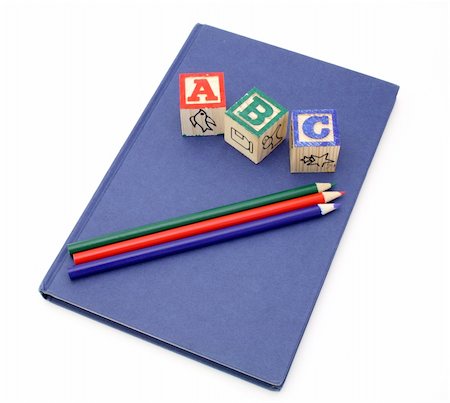 simsearch:600-02346205,k - alphabet blocks and colored pencils over a blue notebook Stock Photo - Budget Royalty-Free & Subscription, Code: 400-04516369