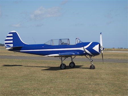 Yak-52 Plane parked on the grass Stock Photo - Budget Royalty-Free & Subscription, Code: 400-04516553