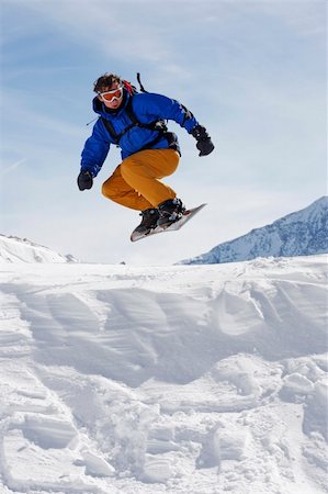 simsearch:400-03985663,k - snowboarder taking jump in fresh snow Stock Photo - Budget Royalty-Free & Subscription, Code: 400-04518191