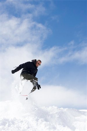 simsearch:400-03985663,k - snowboarder taking jump in fresh snow Stock Photo - Budget Royalty-Free & Subscription, Code: 400-04518193