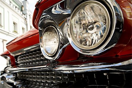 simsearch:600-01716651,k - Forward headlights and lattice of the ancient red car close up Stock Photo - Budget Royalty-Free & Subscription, Code: 400-04518956