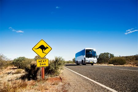 Bus on two lane asphalt road in rural Australia with kangaroo crossing sign. Stock Photo - Budget Royalty-Free & Subscription, Code: 400-04510212