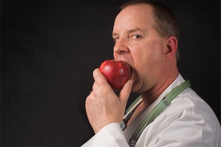 food specialist - An apple a day keeps the doctor away. Photographie de stock - Aubaine LD & Abonnement, Code: 400-04511249