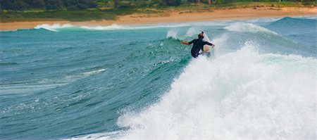 pipeline with man photos - landscape Side shot of a surfer as he cuts back on the crest of a huge wave, the surf starts to break, on the NSW coast, Australia Stock Photo - Budget Royalty-Free & Subscription, Code: 400-04512957